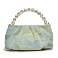 FADED DENIM MARLOWE DENIM POUCH -Lele Sadoughi Shop lele sadoughi bags one size faded denim marlowe denim pouch 36786182979746