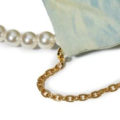 FADED DENIM MARLOWE DENIM POUCH -Lele Sadoughi Shop lele sadoughi bags one size faded denim marlowe denim pouch 36786192154786