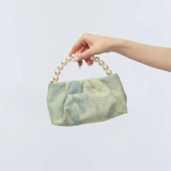 FADED DENIM MARLOWE DENIM POUCH -Lele Sadoughi Shop lele sadoughi bags one size faded denim marlowe denim pouch 36786351177890
