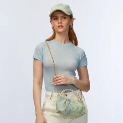 FADED DENIM MARLOWE DENIM POUCH -Lele Sadoughi Shop lele sadoughi bags one size faded denim marlowe denim pouch 36786358419618